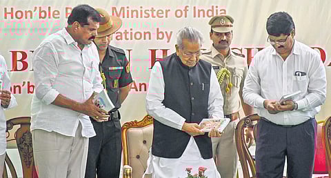 Governor Biswabhusan Harichandan during the release of the Telugu version of Exam Warriors at Raj Bhavan in Vijayawada on Tuesday I Prasant Madugula
