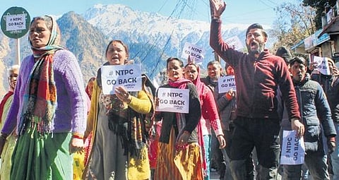 Protest against NTPC project (above); Hotel Mount View being demolished in Joshimath on Friday | PTI