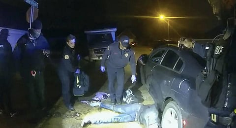 Image shows Tyre Nichols on the ground as medics arrive during a brutal attack by five Memphis police officer. (Photo | AP)