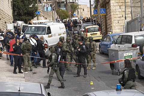 An Israeli policeman secures a shooting attack site in east Jerusalem, Saturday, Jan. 28, 2023.  (Photo | AP)