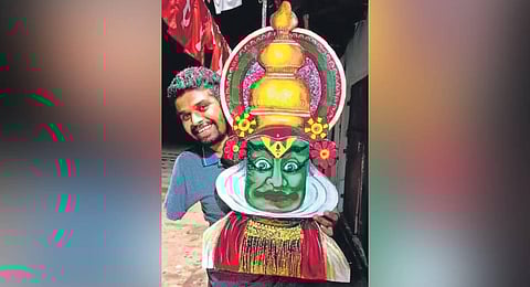 Sanoj Nadayil with one of his paintings. (Photo | Express)