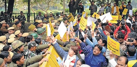 AAP workers engage in a scuffle with security personnel during a protest outside Delhi L-G VK Saxena’s house over the death of Anjali Kumari on Monday | Express