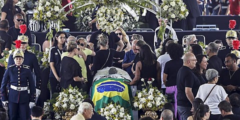 People pay their last respects to the late Brazilian great Pele whose lies in state at Vila Belmiro stadium in Santos, Brazil, Monday, Jan. 2, 2023.(Photo | AP)