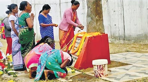 Tribal women paying respects to 14 people killed in police firing in Kalinga Nagar on Monday I Express