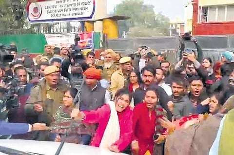 People gathered outside Sultanpuri Police Station on Monday and blocked traffic demanding punishment for the accused in the case | Express