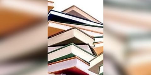Class V student gifts notebooks to Sabitha Indra Reddy