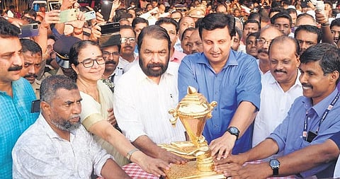 V Sivankutty, Mohamed Riyas, Ahamed Devarkovil, Kozhikode Mayor Beena Philip, and others, receive the golden trophy of the State School Kalolsavam in Kozhikode on Monday | Express