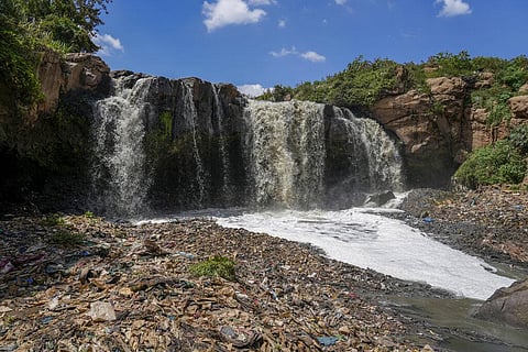 Garbage covers the base of a waterfall of the Nairobi River, which traverses informal settlements and industrial hubs, in the Dandora area of Nairobi, Kenya, Wednesday, Jan. 11, 2023. (Photo | AP)