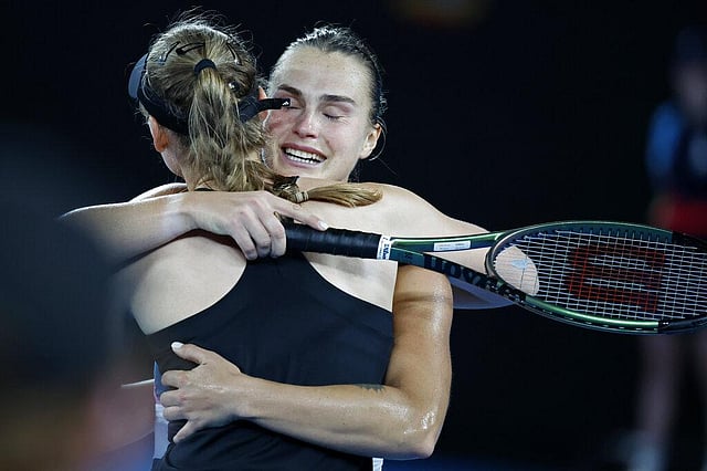 Sabalenka embraces Elena Rybakina of Kazakhstan after winning the women's singles final. She held serve and nerve on her fourth championship point, before dissolving into tears -- of a happy variety this time. (Photo | AP)