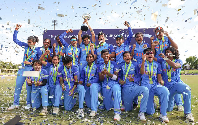 Indian U-19 women's cricket players celebrate with the T20 world cup trophy after beating England, in South Africa's Potchefstroom. (Photo | PTI)
