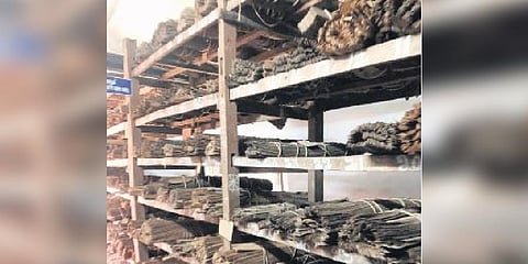 Palm leaf manuscripts that are getting dusted on the shelves of the archives office 