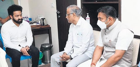 Actor Junior NTR interacts with Health Minister Dr K Sudhakar in Bengaluru on Sunday