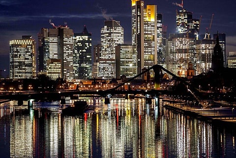 A cargo ship passes the buildings of the banking district in Frankfurt, Germany, Dec. 14, 2022. (Photo | AP)