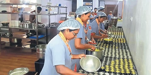 Employees preparing lunch at the Padma Café in Adoor