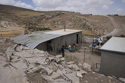 A Palestinian man walks inside his house in the West Bank Beduin community of Jinba, Masafer Yatta, May 6, 2022. (File Photo | AP)