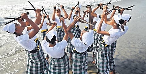 Students of Thiruvangoor Higher Secondary School practising kolkali on Kozhikode Beach before their performance | pics: E Gokul