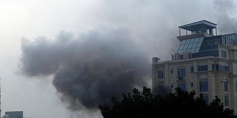 Smoke rises from a hotel building after an explosions and gunfire in the city of Kabul, Afghanistan, Monday, Dec  12, 2022.