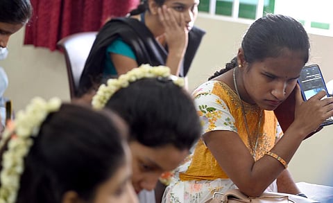 Visually-challenged students go through newly released Braille books, on the occasion of World Braille Day, organised by the APS Education Foundation in Bengaluru. (Photo | Nagaraja Gadekal, EPS)