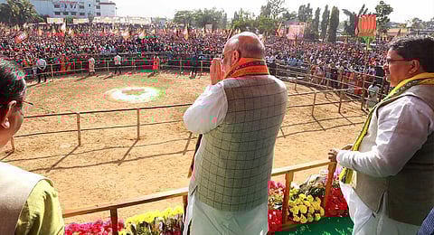 Union Home Minister Amit Shah with Tripura Chief Minister Manik Saha during a rally for the launch of BJP's 'Jan Vishwas Yatra', in Dharmanagar, Thursday, Jan. 5, 2023. (twitter image via @Amit Shah)