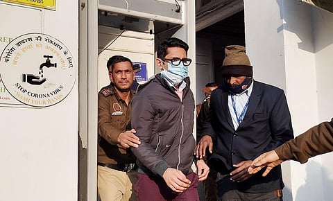 Delhi police takes away accused Shankar Mishra after producing him before the Patiala House Court. (Photo | PTI)