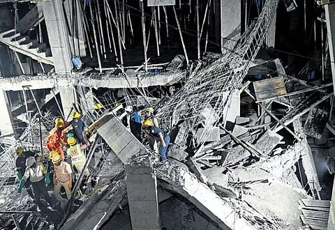 Workers remove the rubble from the collapsed building at Pragathi Nagar in Kukatpally on Saturday | Vinay Madapu