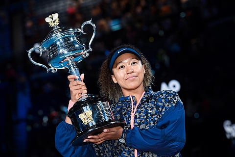 Japan's Naomi Osaka posing with winner's trophy after defeating Jennifer Brady of the US in their women's singles final match of the Australian Open in Melbourne, February 20, 2021. (File Photo | AFP)