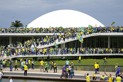 Protesters, supporters of Brazil's former President Jair Bolsonaro, storm the National Congress building in Brasilia, Brazil, Sunday, Jan. 8, 2023. (Photo |AP)