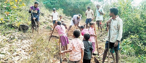 Tribals of hilltop village Neredu Bandha in Alluri Sitarama Raju district lay a road on their own with ‘shramdan’ for their children to go to school I express