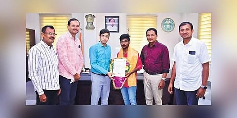 Abhishek being felicitated by collector Anuraag Jayanti, along with other officials, on Saturday