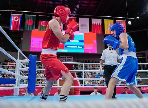 India's Parveen Hooda (red) competes against Uzbekistan's Sitora Turdibekova in the Women's 54-57kg Boxing Quaterfinal match at the 19th Asian Games on Sunday, October 1, 2023. (Photo | PTI)
