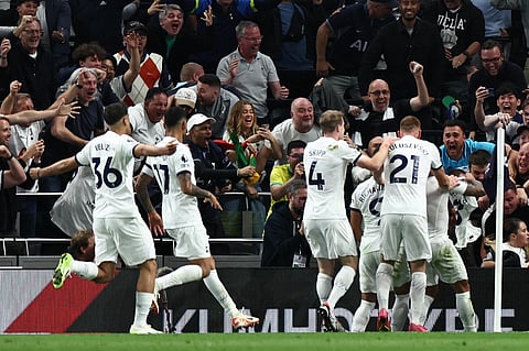 Tottenham Hotspur's players celebrate following the own goal scored by Liverpool's Joel Matip. (Photo | AFP)