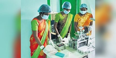 Women are seen manufacturing sanitary napkins in Konaimakula village 