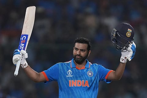 India's captain Rohit Sharma celebrates his century during the World Cup match against Afghanistan (Photo | AP)