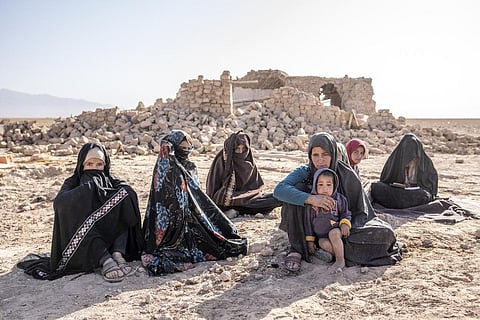 Afghan women sit in front of their houses that were destroyed by the earthquake in Zenda Jan district in Herat province, western of Afghanistan, Wednesday, Oct. 11, 2023. (Photo | AP)