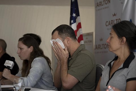Nahal Neta, son of Adrienne Neta, 66, a nurse missing since a Hamas attack, weeps during a  news conference by US citizens in Tel Aviv, Oct 10, 2023. (Photo | AP)