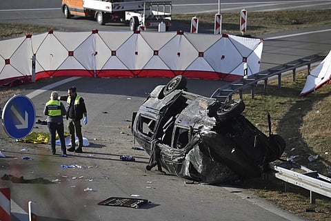 Police attendants stand by an overturned vehicle on highway A94 near Muehldorf, Germany, Friday, Oct 13, 2023. (Photo | AP)