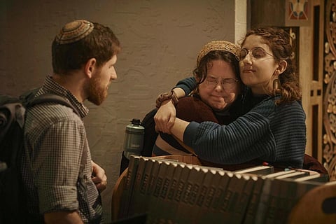 Jews hug after a communal prayer to honour and offer support for the victims in Israel in B'nai Jeshurun Synagogue on Oct 12, 2023. (Photo | AP)