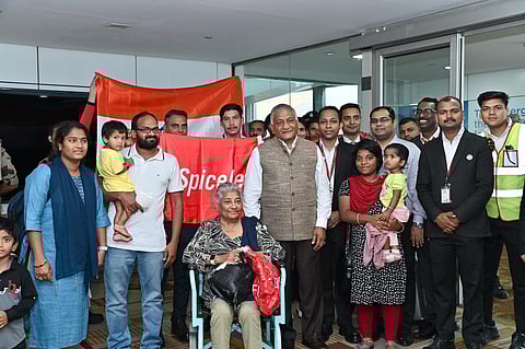 Minister of State for Road Transport & Highways and Civil Aviation, Vijay Kumar Singh, welcomes passengers who arrived from Tel Aviv on Sunday. (Photo | MEAIndia Twitter)