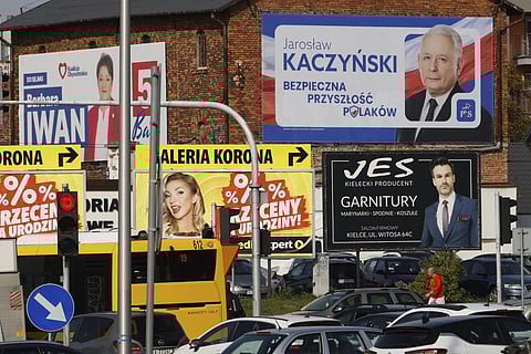 A political campaign billboard for the head of Poland's ruling party  Jaroslaw Kaczynski hangs on a building in Kielce, Poland, Wednesday, Oct 11, 2023. (Photo | AP)
