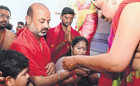 BJP general secretary and Karimnagar MP Bandi Sanjay takes ‘deeksha’ as part of Devi Navaratri celebrations at Sri Mahasakthi temple in Karimnagar on Sunday | Express
