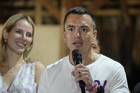 Presidential candidate Daniel Noboa speaks in Olon, Ecuador, after results show him ahead in a snap presidential runoff on Sunday, Oct. 15, 2023. At left is his wife Lavinia Valbonesi. (AP)