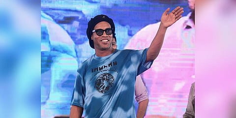 Brazilian football icon Ronaldinho waves at fans during the inauguration of 'R 10 Academy' at Rajarhat on the outskirts of Kolkata (Photo | PTI)