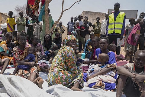 South Sudanese who fled from Sudan sit outside a nutrition clinic at a transit centre in Renk, South Sudan, on May 16, 2023. (Photo | AP)