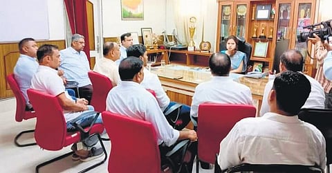 BJD members engaged in discussion with the Sambalpur collector. (Photo | Express)