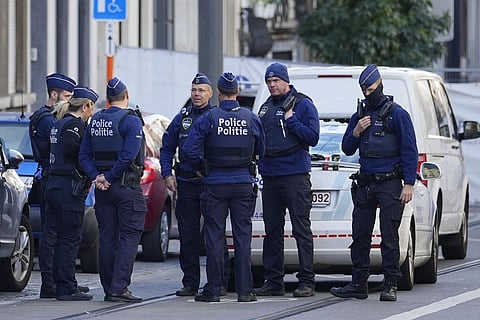 Belgian Police patrol behind a cordoned off area close to where a suspected Tunisian extremist has been shot dead. (Photo | AP)