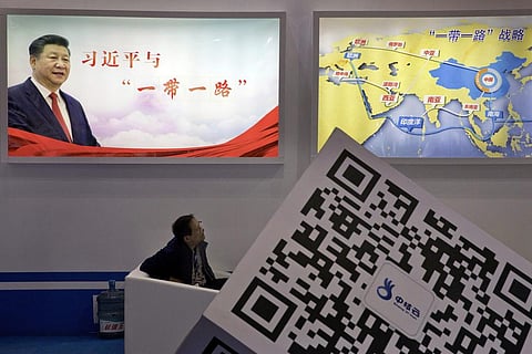 FILE - A portrait of Chinese President Xi Jinping with the words 'Xi Jinping and One Belt One Road' and 'One Belt One Road strategy,' in Beijing, April 28, 2017. (Photo | AP)