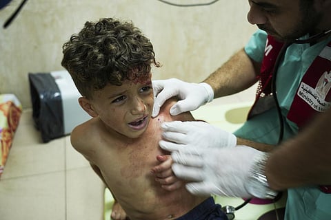 Palestinian child wounded in Israeli bombardment is treated in a hospital in Deir al-Balah, south of the Gaza Strip (Photo | AP)