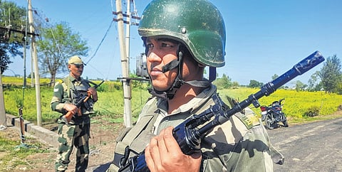 Border Security Force (BSF) personnel stand guard near India-Pakistan border in the Arnia sector, on the outskirts of Jammu, on Wednesday | pti