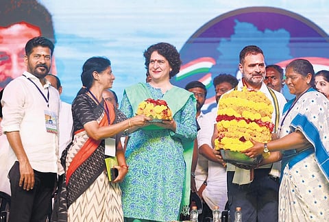 Congress leader Rahul Gandhi receives a Bathukamma from MLA Dansari Anasuya during a public meeting at Mulugu on Wednesday