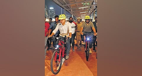 KT Rama Rao is seen riding a bicycle after inaugurating the 23-km-long bicycle track at Narsingi on Sunday. (Photo | Sri Loganathan Velmurugan)